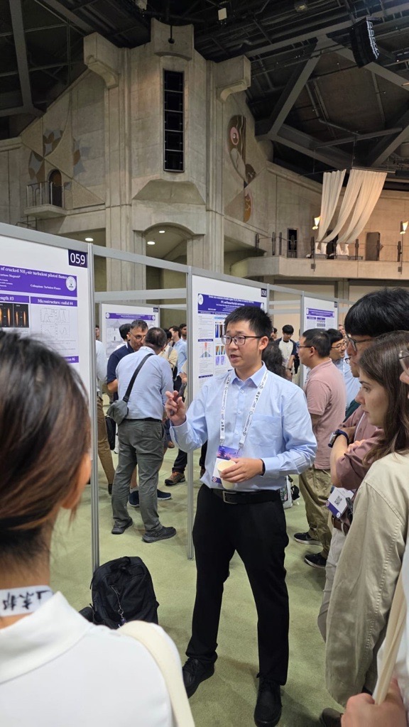 Prof. Tang presenting a research poster at ISOC 2026 in Kyoto